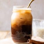 Iced Horchata Shaken Espresso in a glass with a straw.