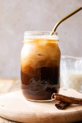 Iced Horchata Shaken Espresso in a glass with a straw.