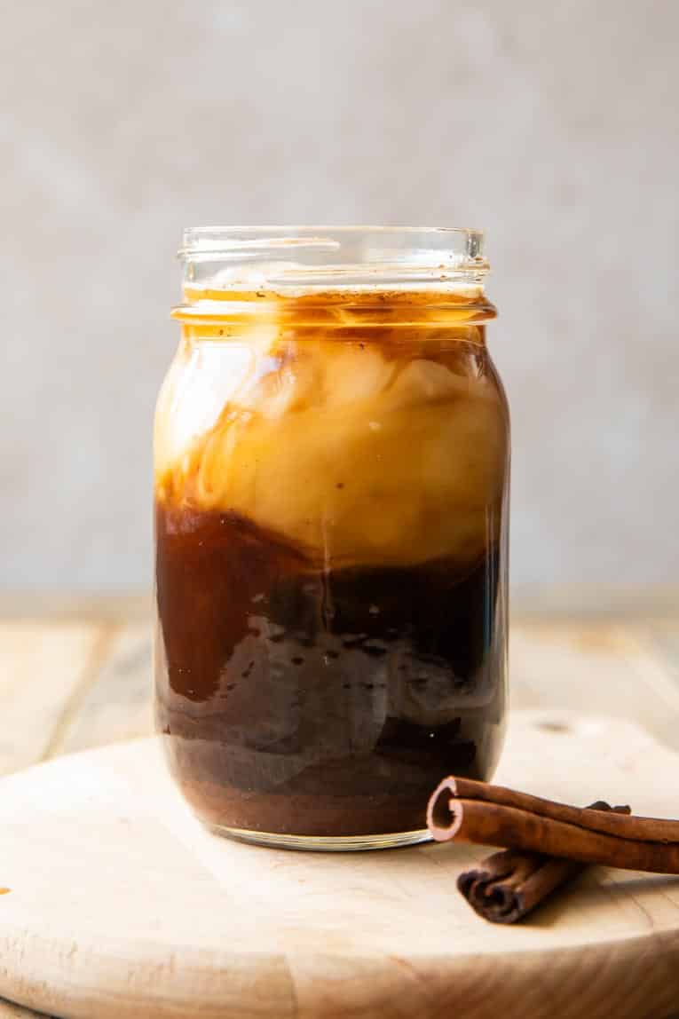 Oatmilk shaken espresso in a mason jar.