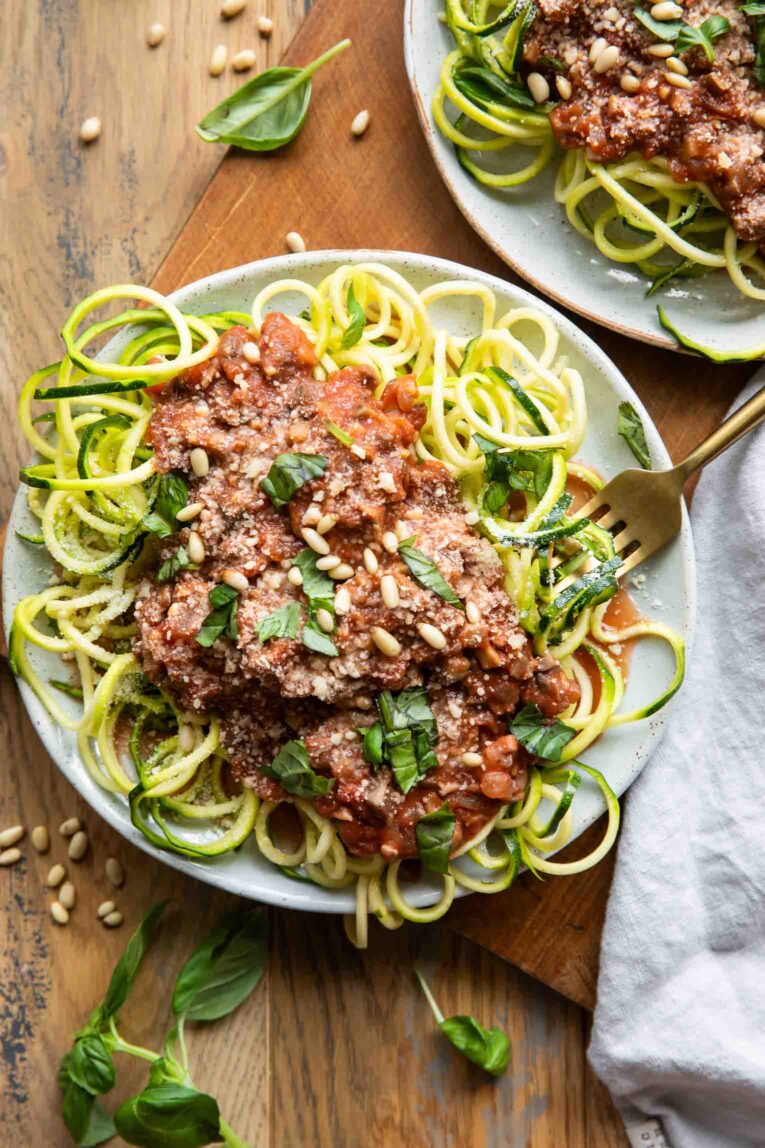 Plate of zucchini spaghetti with sauce.