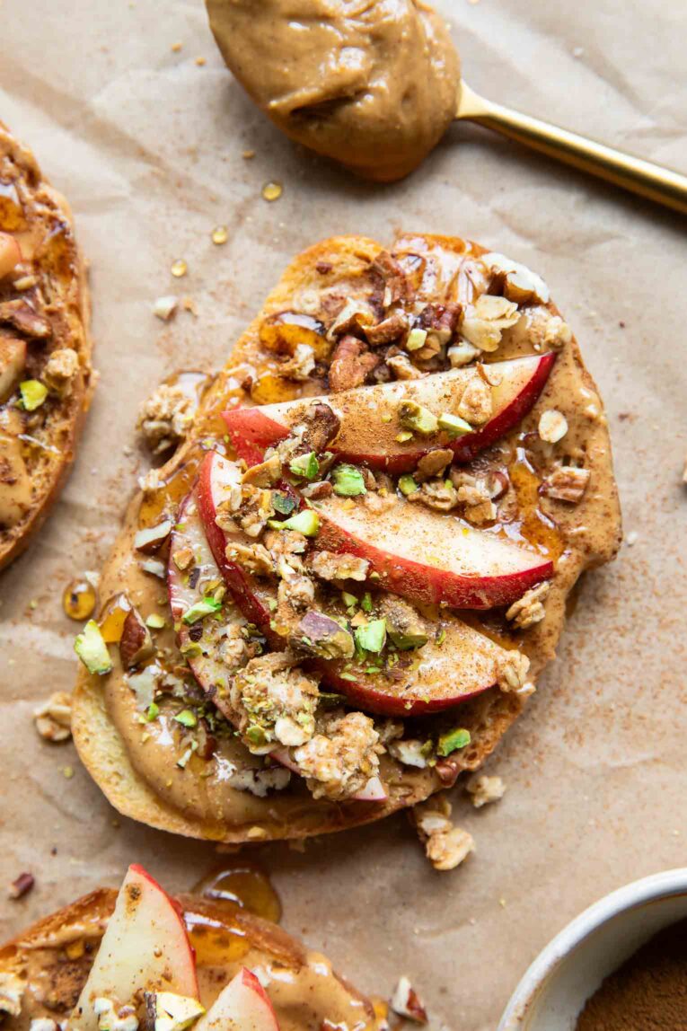 Apple Cinnamon Peanut Butter Breakfast Toast with honey and granola.