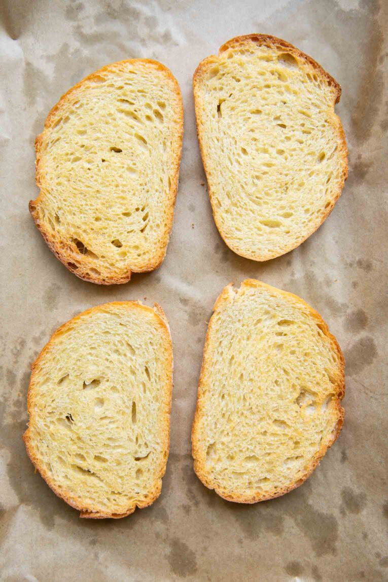 Four pieces of sourdough toasted bread.