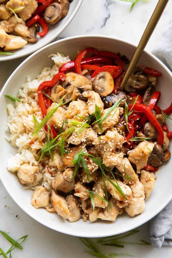 Top Photo General Taos Chicken with rice and red pepper.