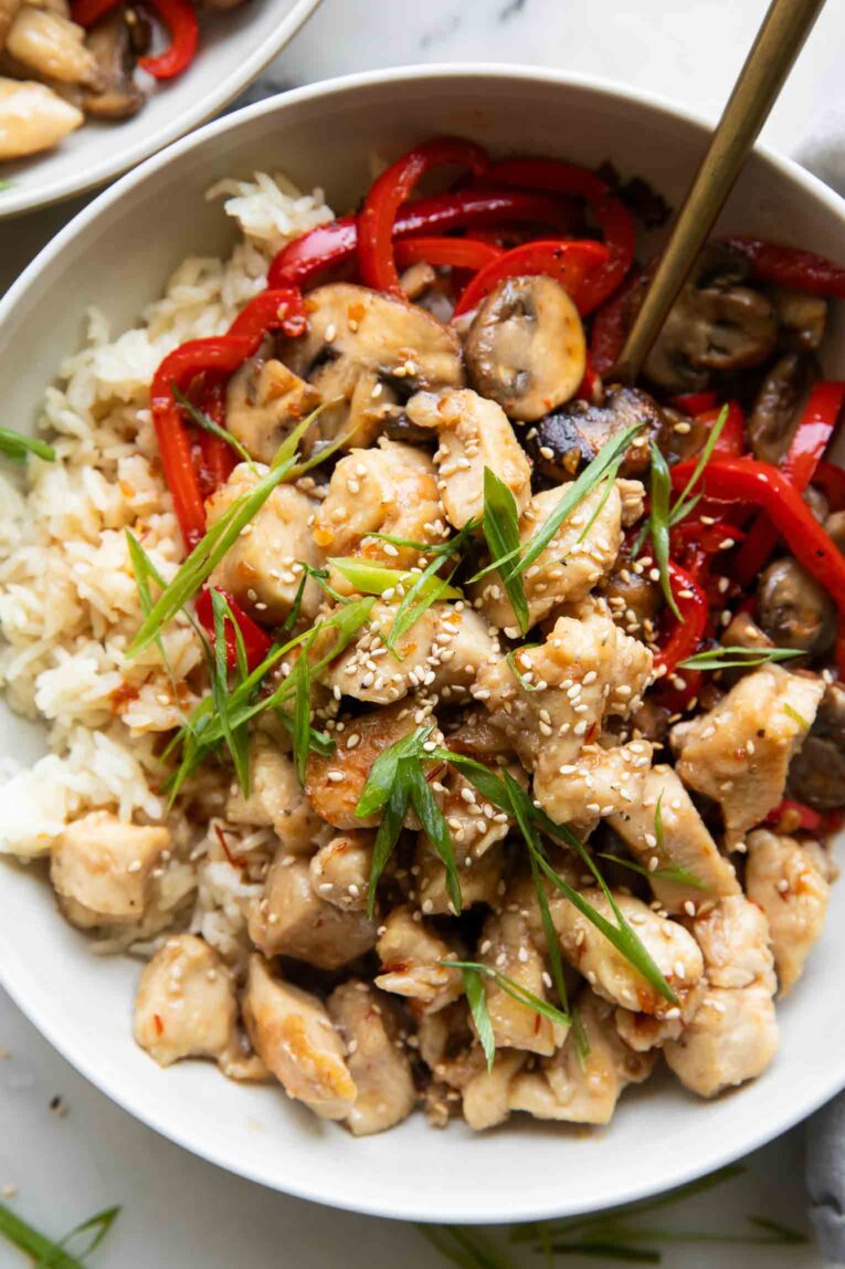 Top Photo General Taos Chicken with rice and red pepper.