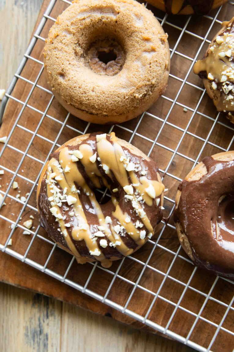 Peanut Butter Chocolate Healthy Donuts on a cooling rack.