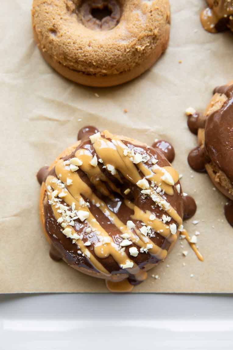 Close up of cottage cheese donut with peanut butter drizzle.