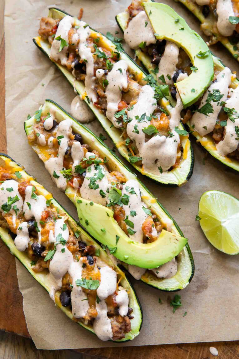 Ground Turkey Zucchini Boats with avocado and cream sauce.