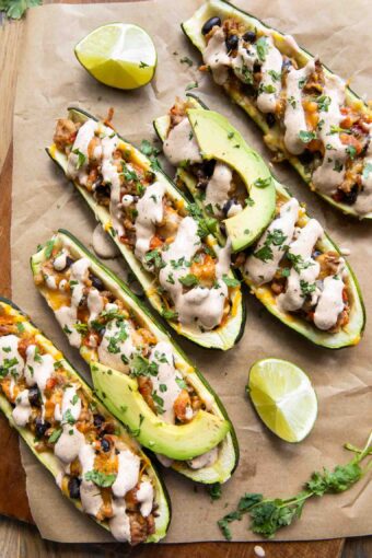 Southwestern Zucchini Boats topped with cream sauce.