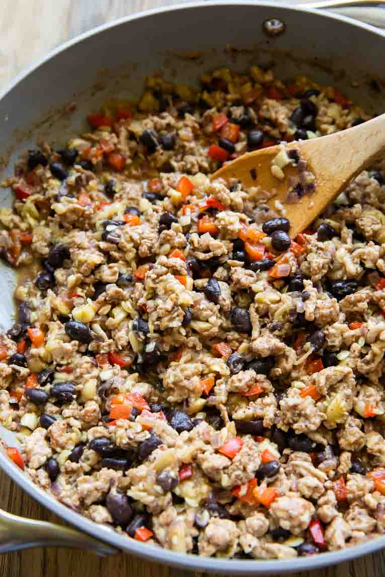 Southwestern ground turkey being cooked in a skillet.
