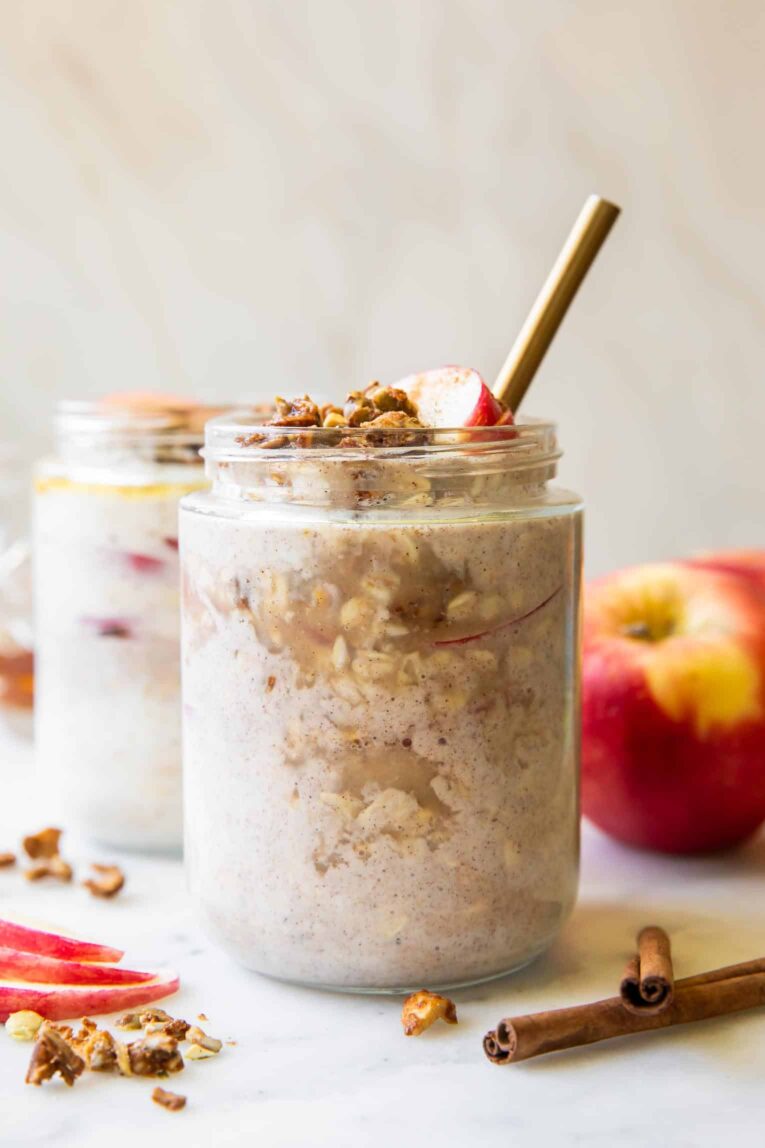 Across photo of apple cinnamon overnight oats in jars.