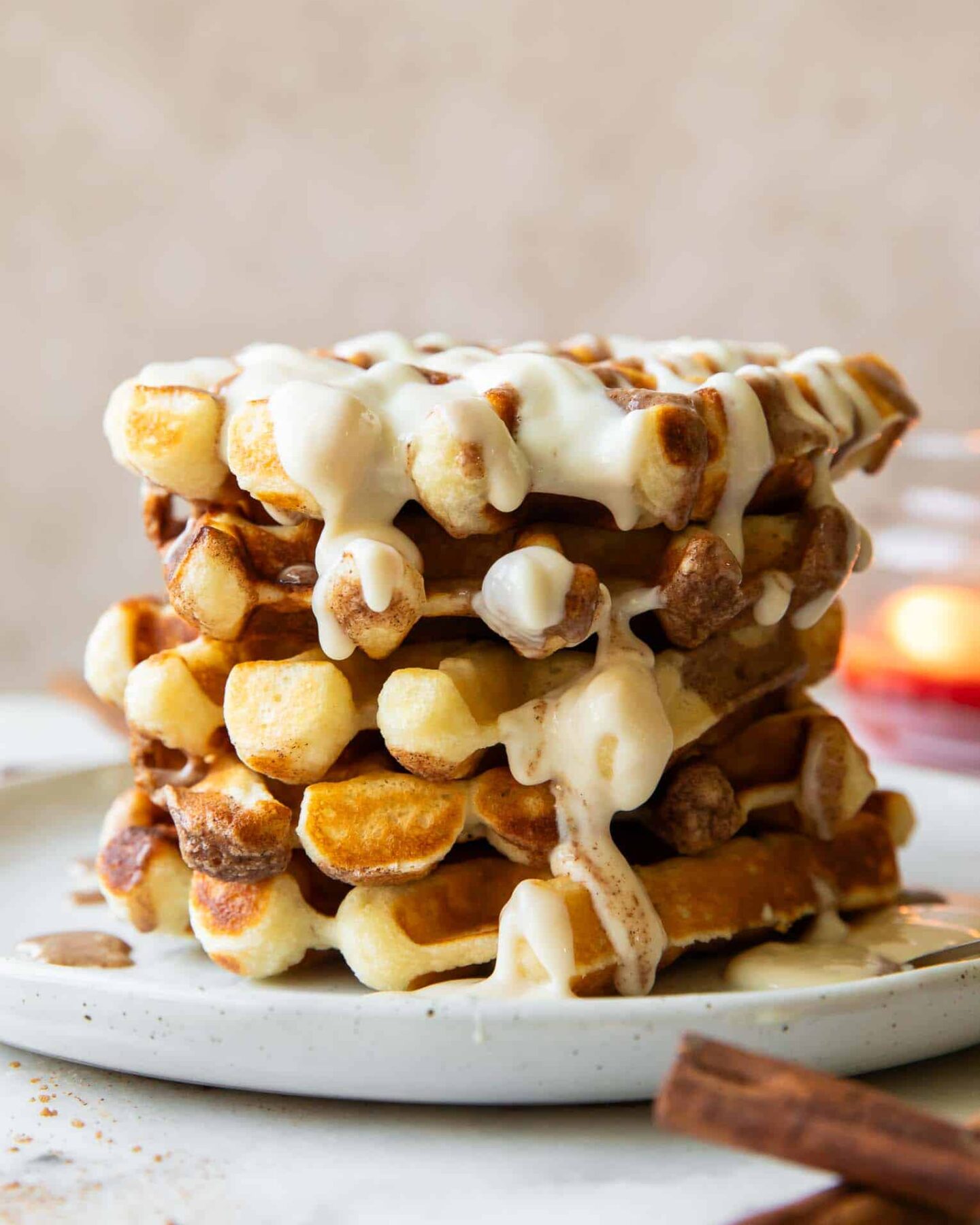Stack of cinnamon roll waffles.