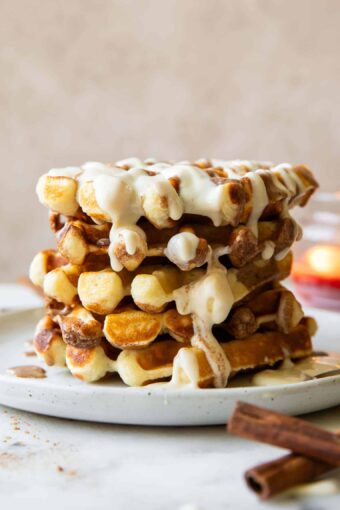 Stack of cinnamon roll waffles.