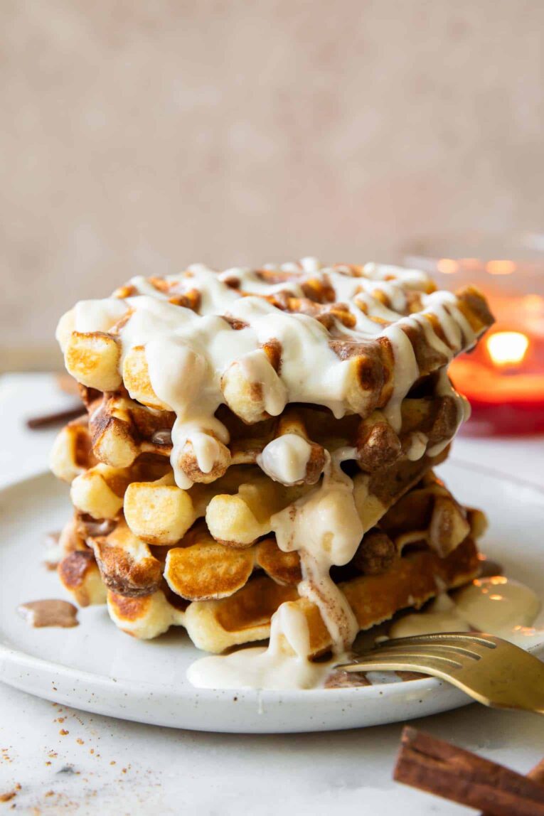 Stack of cinnamon roll waffles.