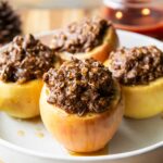 Maple crumble baked apples on a plate.