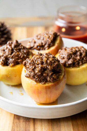 Maple crumble baked apples on a plate.