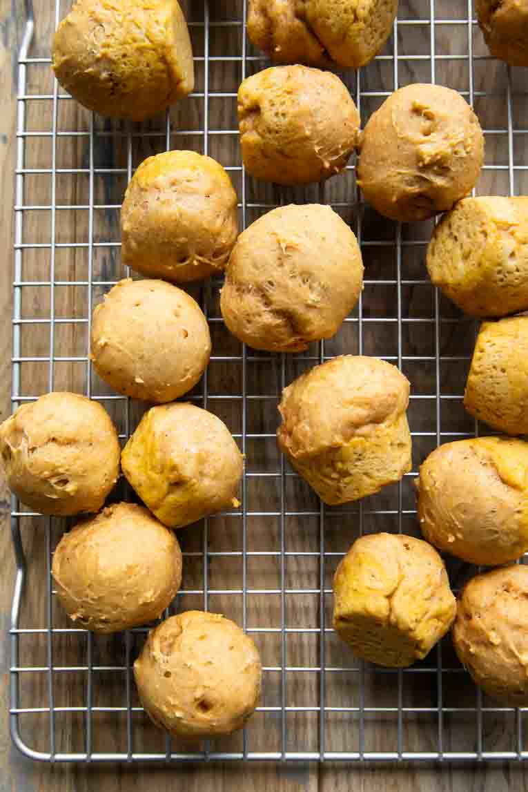 Pumpkin Donut Holes on a cooling rack.