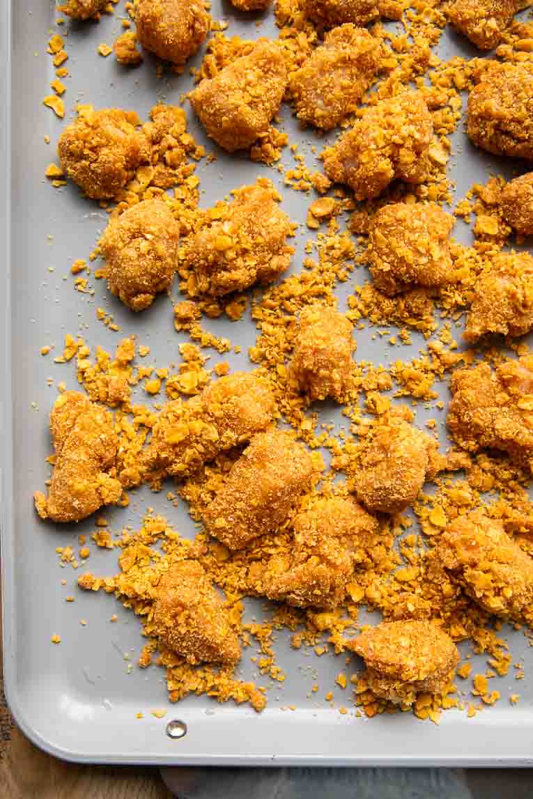 Chicken on a baking sheet.