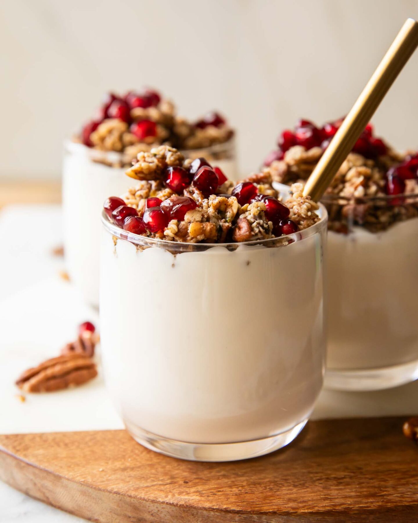 Three pomegranate parfaits.