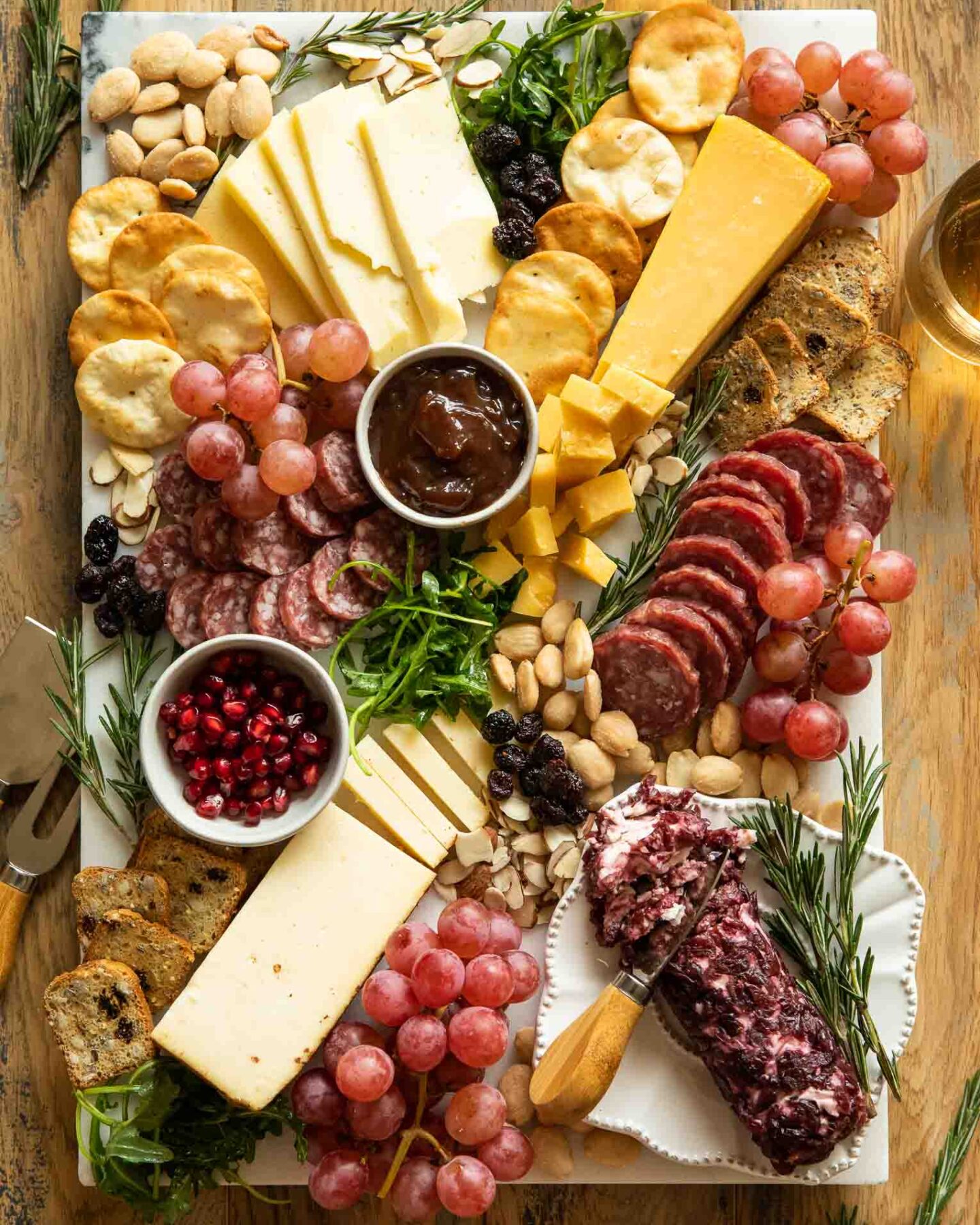 Christmas charcuterie board with meats, crackers, and cheese.