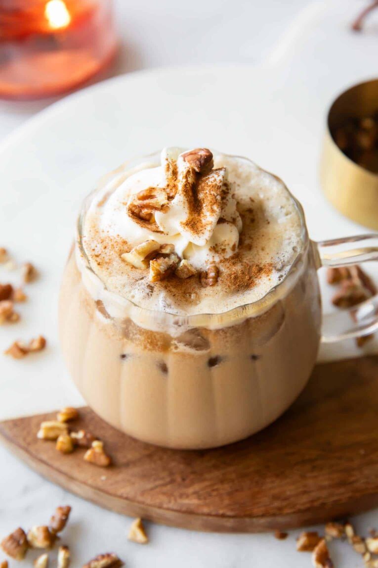 Angled image of Maple Pecan Latte in a glass mug.