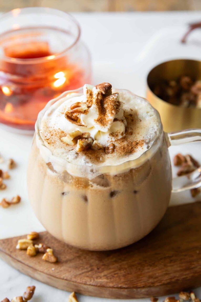 Angled image of Maple Pecan Latte in a glass mug.