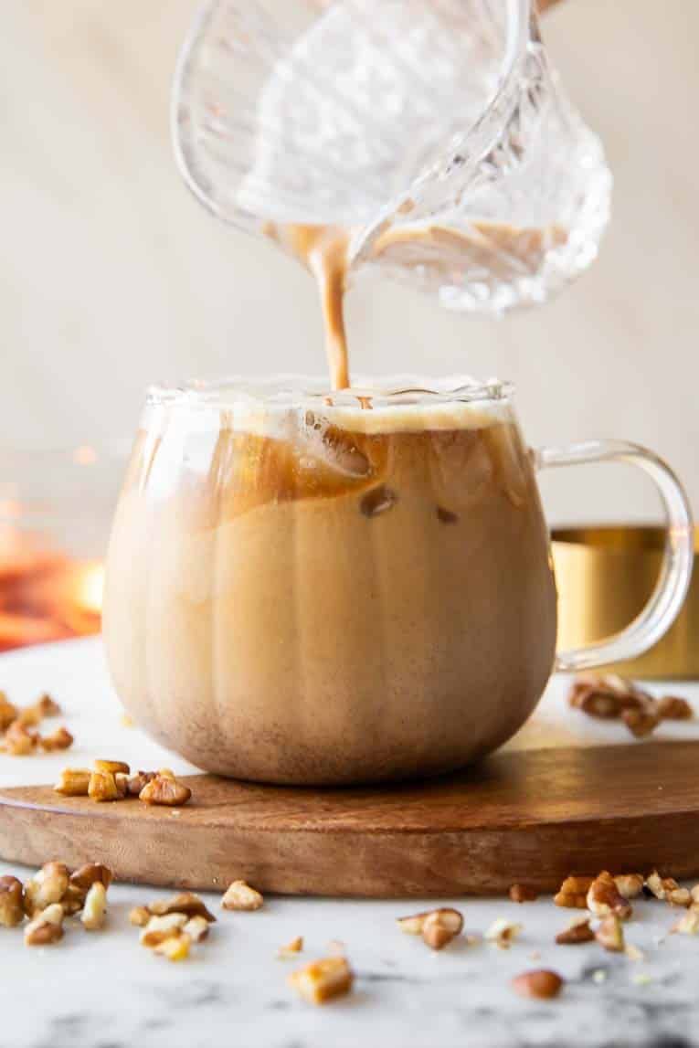 Creamer being poured into maple pecan latte.