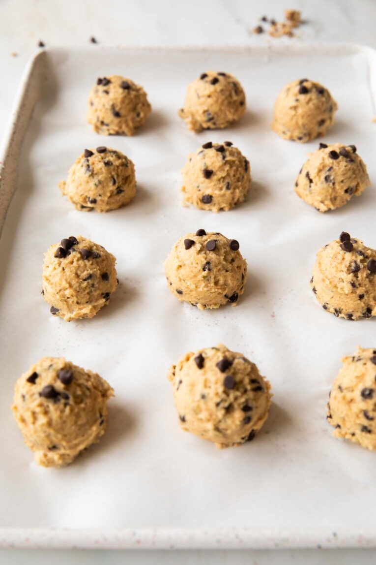 Cookie dough cottage cheese bites on a baking sheet.
