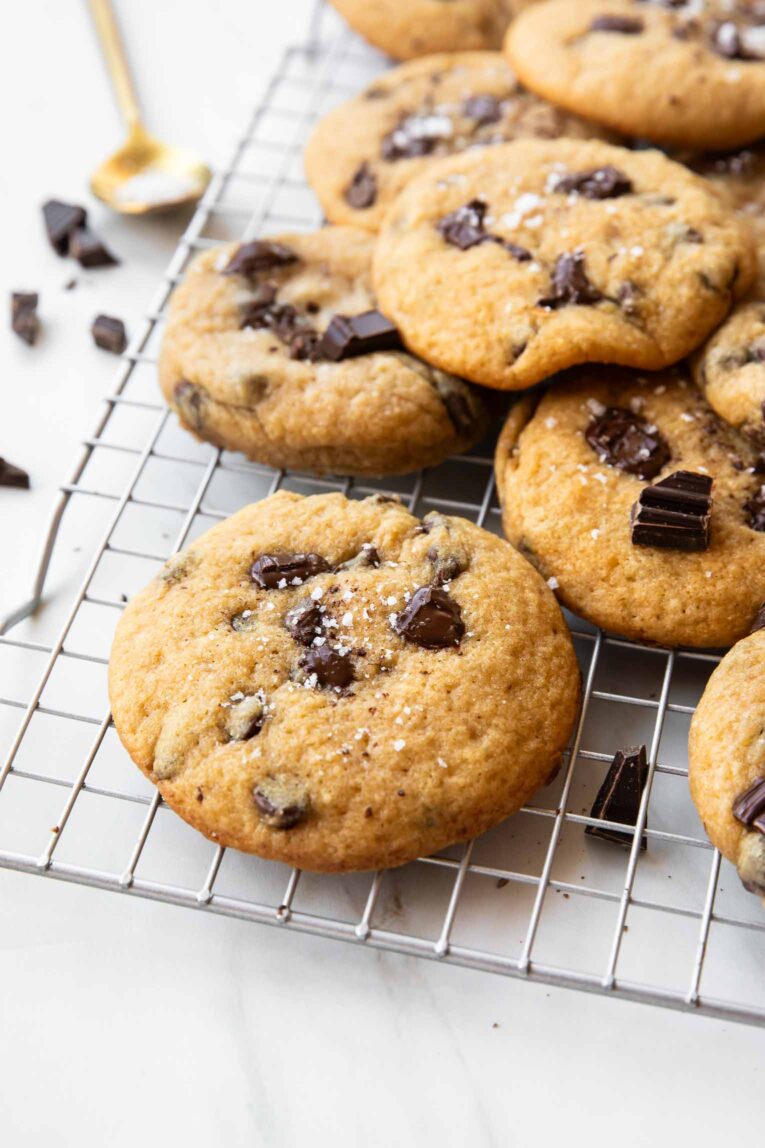 Angled image of Cottage Cheese Chocolate Chunk Cookies on a cooling rack.