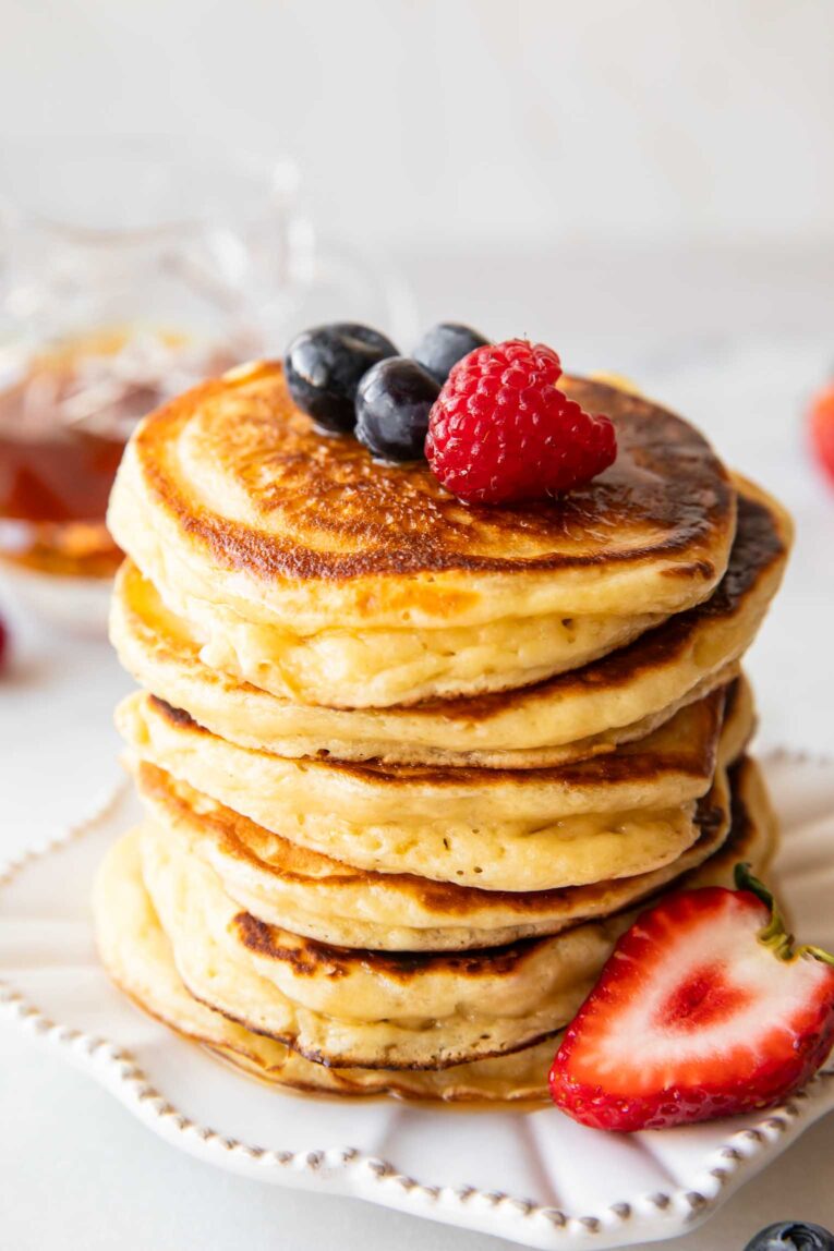 Angled image of A stack of greek yogurt pancakes.