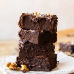 Black bean brownies stacked on top of each other.