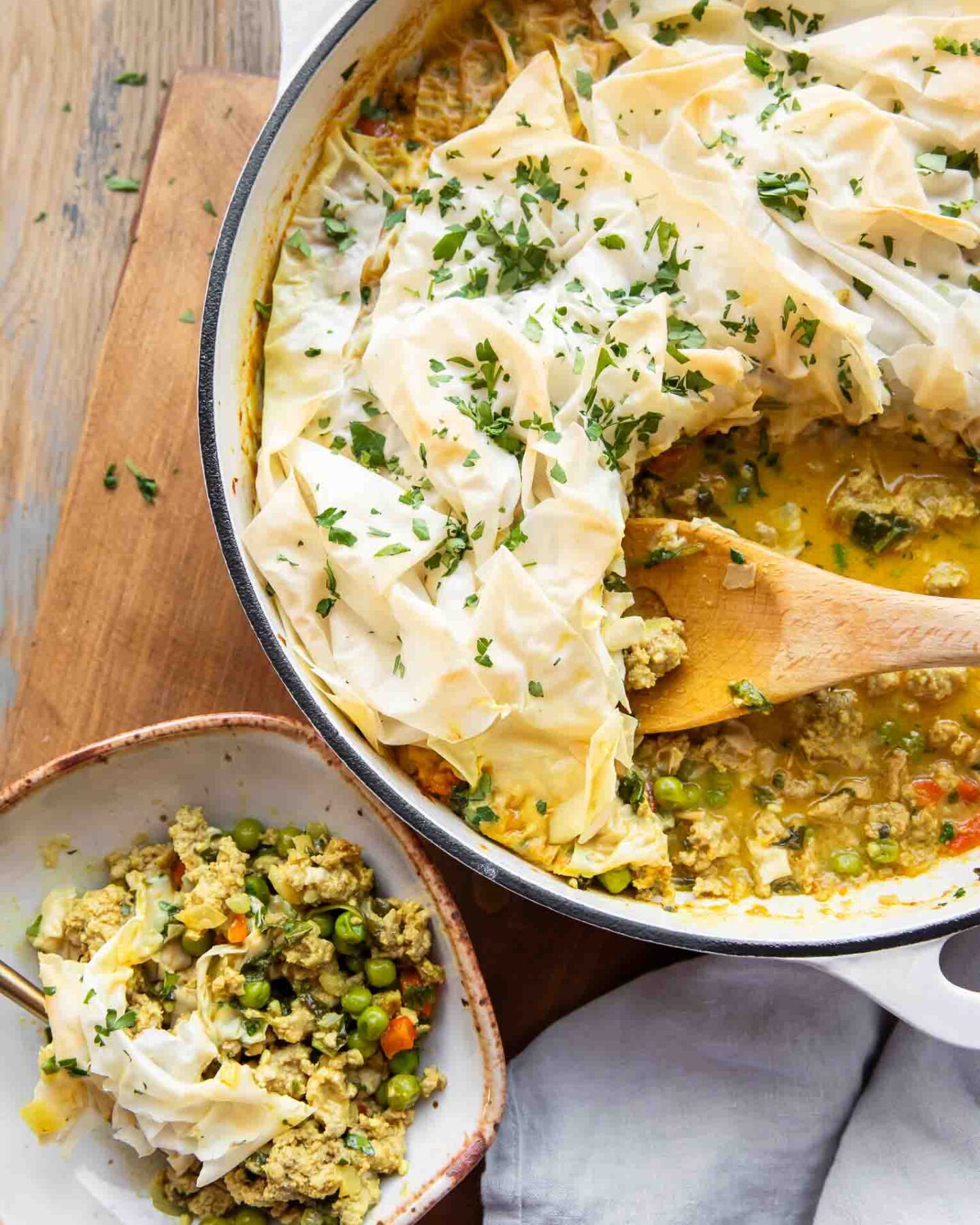 Phyllo Topped Ground Turkey Casserole in a pot and served on a plate.