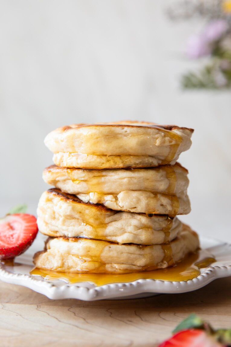 A stack of Souffle Pancakes on a plate.