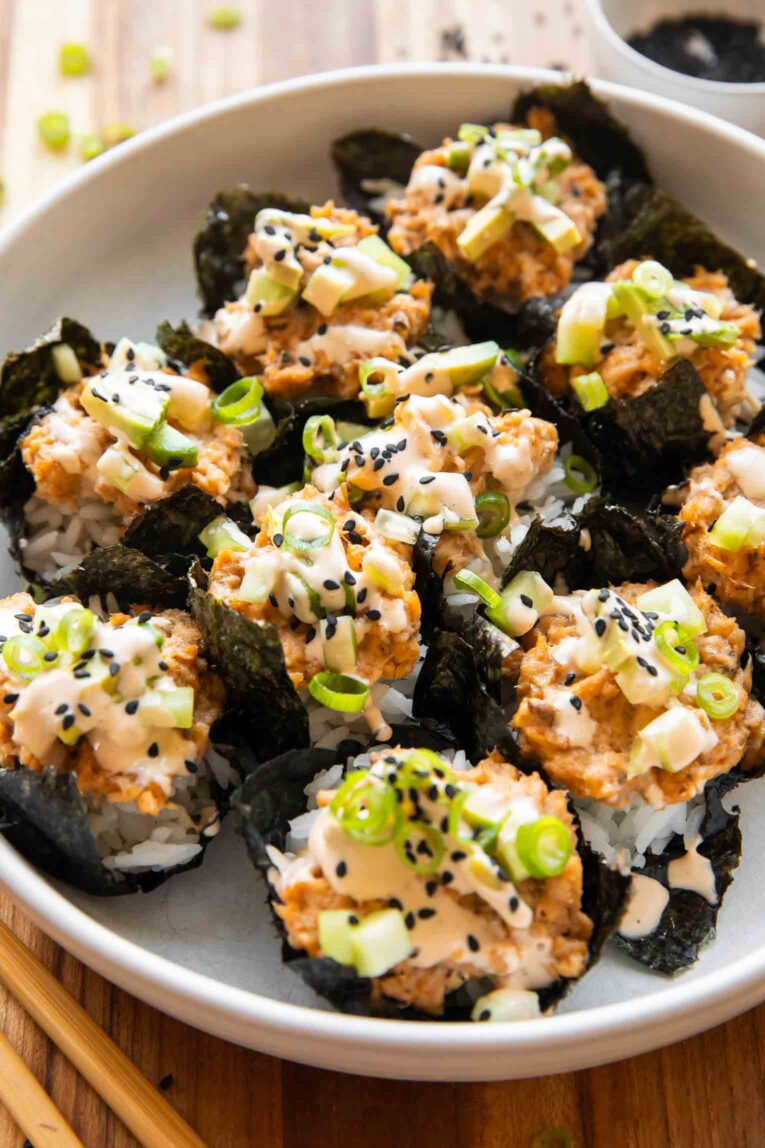 Angled image salmon sushi cups.