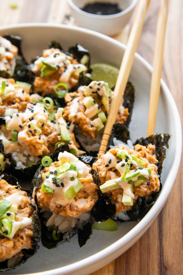 Salmon sushi cups with chopsticks.