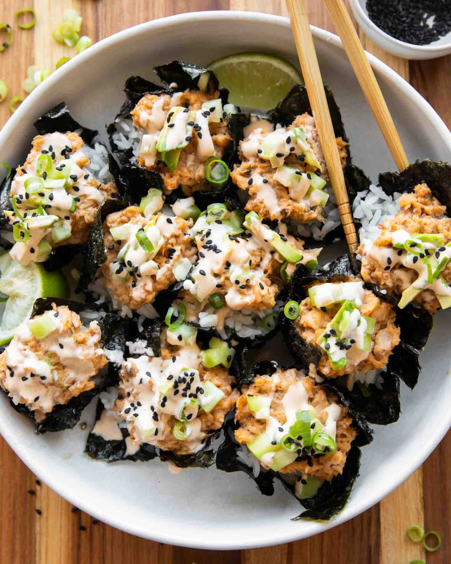 Salmon sushi cups with chopsticks.