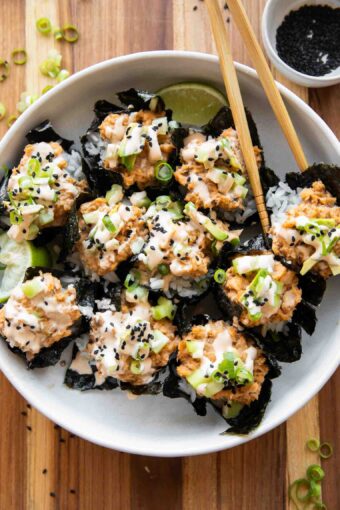 Salmon sushi cups with chopsticks.