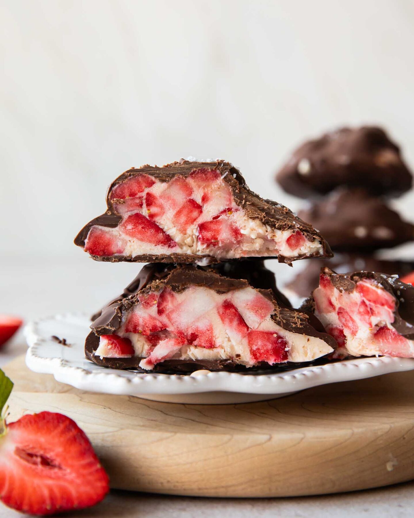 Strawberry chocolate yogurt bite cut in half.