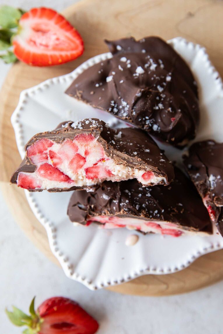 Strawberry chocolate yogurt bite cut in half stacked on a plate.