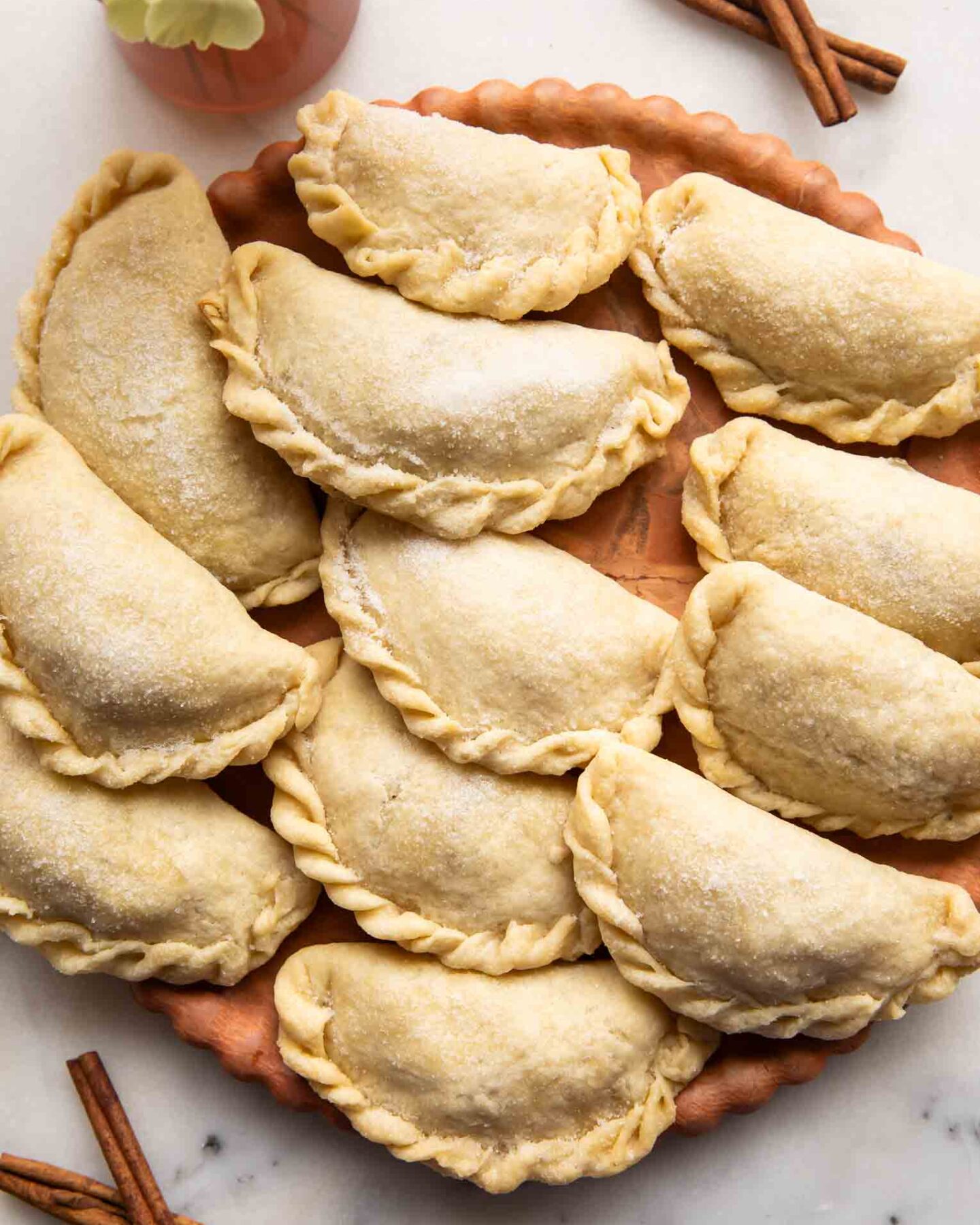 Nicaraguan Pastelitos on a wooden surface.