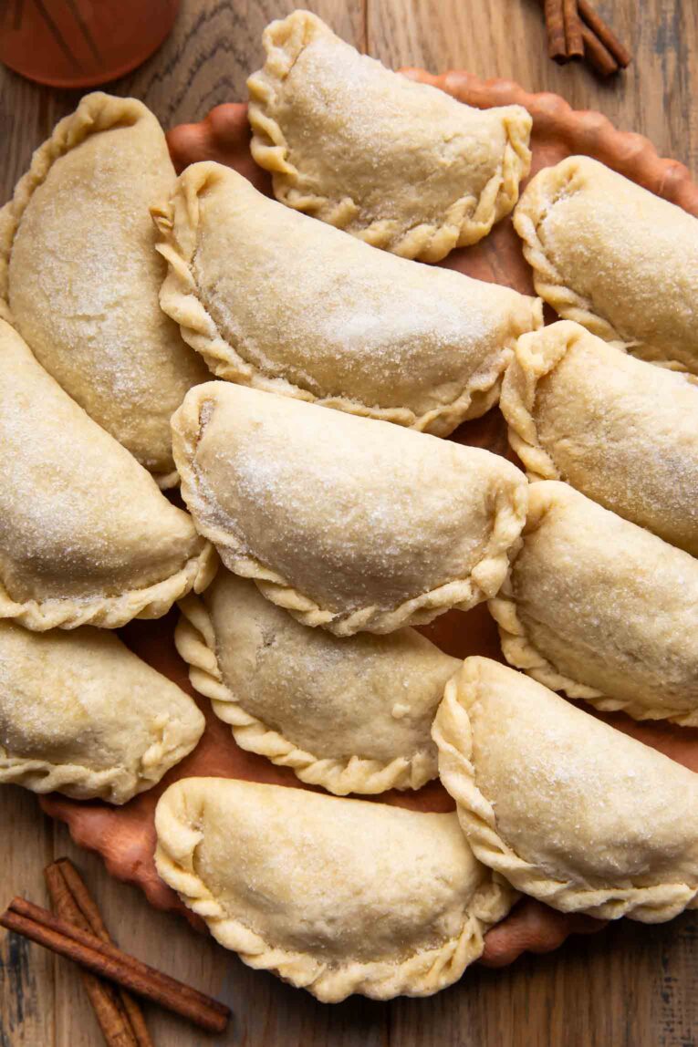 Nicaraguan Pastelitos on a wooden surface.
