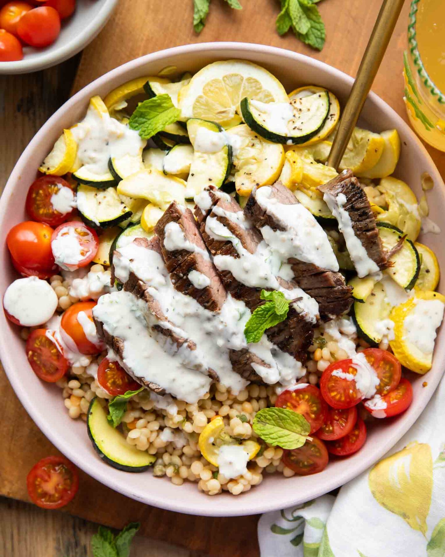 Steak Couscous Bowl on a cutting board.