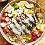 Steak Couscous Bowl on a cutting board.