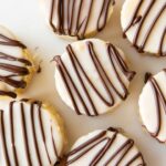Top view of zebra cakes on a cutting board.