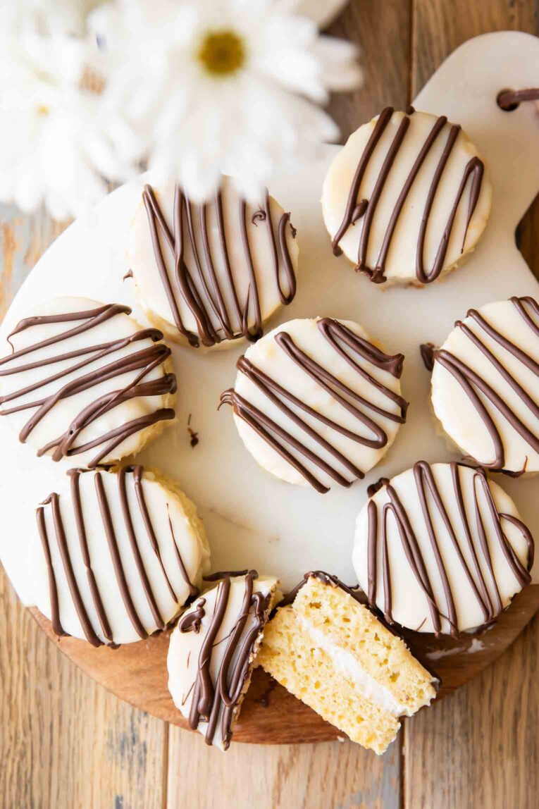 Zebra cakes on a cutting board.