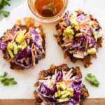 Hot honey sweet potato waffles on a cutting board.