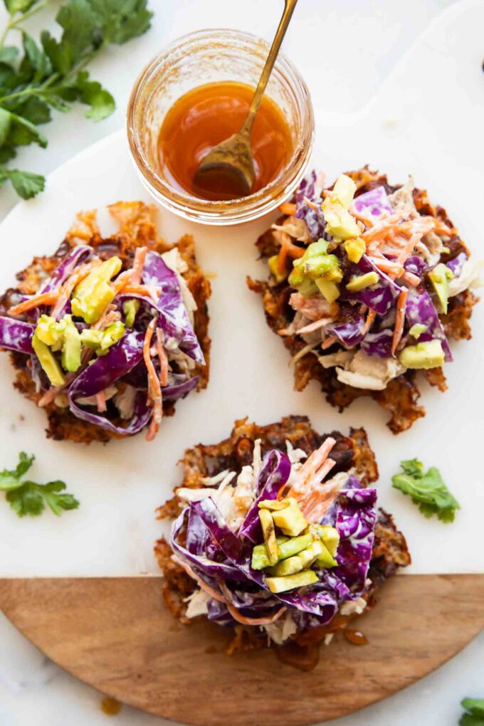 Hot honey sweet potato waffles on a cutting board.