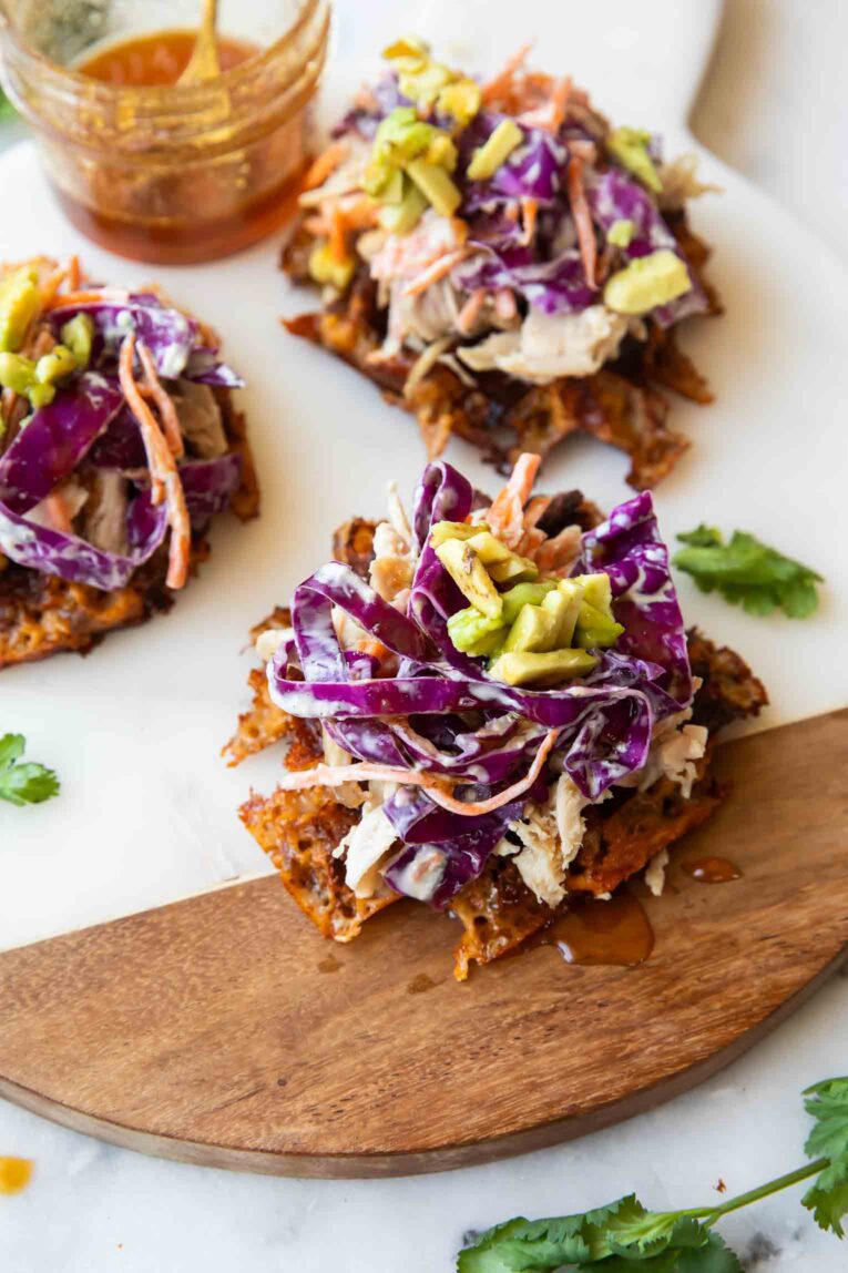 Hot honey sweet potato waffles on a cutting board.