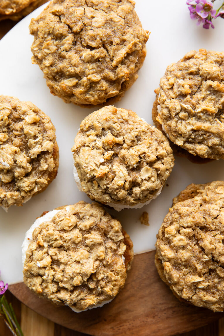 Oatmeal cream pies on a cutting board.
