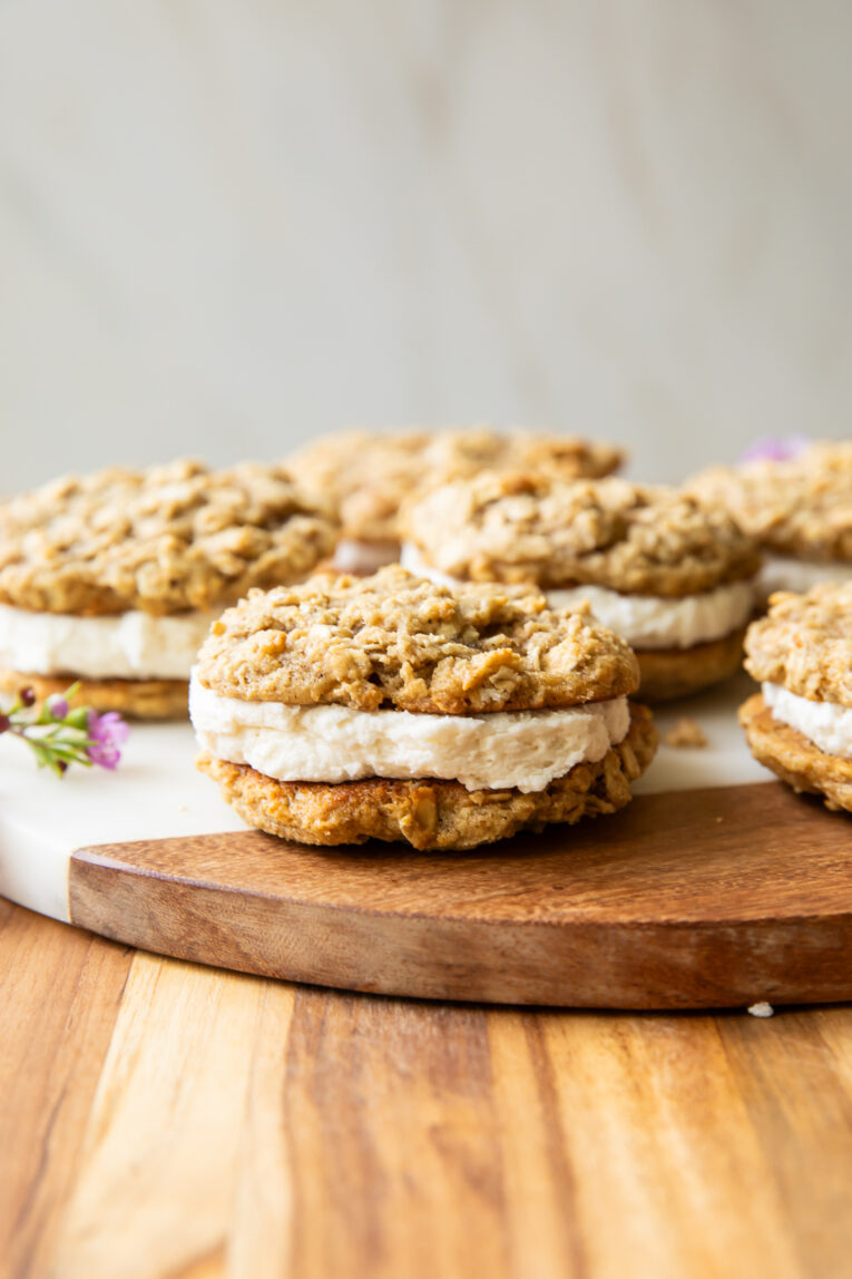 Oatmeal cream pies on a cutting board.