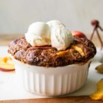 Baked Peach oats in a dish.